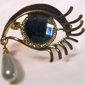 Elegant Gold Eye Brooch with Pearl Drop